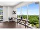 Scenic view from the floor-to-ceiling windows, complete with a cozy desk and stylish decor at 1820 Peachtree St # 1607, Atlanta, GA 30309