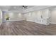 Spacious basement featuring modern flooring, a wet bar, and a door to the outdoor area at 2517 Hampton Park Ct, Marietta, GA 30062