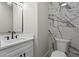 A modern half bathroom featuring marble accent wall, floating vanity with black hardware, and modern fixtures at 2517 Hampton Park Ct, Marietta, GA 30062