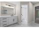 Modern bathroom with white vanity, black hardware, and elegant marble-like tile flooring at 2517 Hampton Park Ct, Marietta, GA 30062