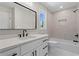 Modern bathroom featuring white cabinets, quartz countertop, and tile backsplash in shower at 2517 Hampton Park Ct, Marietta, GA 30062
