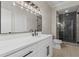Modern bathroom with black accents, dual vanity, stylish lighting, and a glass-enclosed shower at 2517 Hampton Park Ct, Marietta, GA 30062