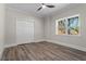 Neutral bedroom featuring hardwood flooring, a ceiling fan, double closets and natural light at 2517 Hampton Park Ct, Marietta, GA 30062