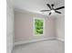 Bright bedroom with a ceiling fan and a window view of the lush outdoors at 2517 Hampton Park Ct, Marietta, GA 30062