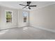 Spacious bedroom filled with natural light from two windows and neutral carpeting at 2517 Hampton Park Ct, Marietta, GA 30062