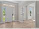 Bright entryway featuring hardwood floors, a sidelight window, and an open doorway at 2517 Hampton Park Ct, Marietta, GA 30062