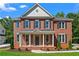 Charming two-story brick home with a welcoming front porch and classic architectural details at 2517 Hampton Park Ct, Marietta, GA 30062