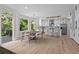 Bright kitchen with white cabinetry, stainless steel appliances, and an adjacent dining area at 2517 Hampton Park Ct, Marietta, GA 30062