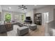 A stylish living room with comfortable seating, a modern entertainment center, and large windows at 2517 Hampton Park Ct, Marietta, GA 30062