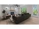 Cozy living room with a fireplace, built-in shelving, and large windows at 2517 Hampton Park Ct, Marietta, GA 30062