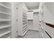 A very large walk-in closet with custom shelving, drawers, and ample storage space at 2517 Hampton Park Ct, Marietta, GA 30062