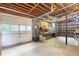 Spacious basement with garage door, workbench and storage shelves, great for a workshop and storage at 5670 Lanny Dr, Powder Springs, GA 30127