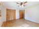 A bedroom boasts hardwood floors, a ceiling fan, and a closet with sliding doors at 5670 Lanny Dr, Powder Springs, GA 30127