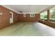 Covered carport featuring a brick wall, white door, and a ceiling fan at 5670 Lanny Dr, Powder Springs, GA 30127