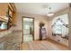 Open kitchen area with granite countertops and charming breakfast nook at 5670 Lanny Dr, Powder Springs, GA 30127
