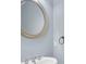 Stylish powder room with modern fixtures, a round mirror, and elegant vanity at 6206 Carriage Gate Se Ln # 6, Mableton, GA 30126
