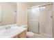 Bathroom with single sink vanity and a glass enclosed shower at 1321 Waterton Trl, Douglasville, GA 30134