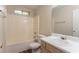 Bright bathroom features a tub-shower combination, single sink vanity, and wood-look flooring at 1321 Waterton Trl, Douglasville, GA 30134