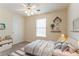 This lovely bedroom has a bed, a nightstand and tasteful decorations at 1321 Waterton Trl, Douglasville, GA 30134