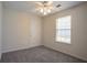 Neutral bedroom with a ceiling fan, and large window at 1321 Waterton Trl, Douglasville, GA 30134