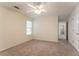 Bedroom with neutral walls, plush carpet, a window, and a closet at 1321 Waterton Trl, Douglasville, GA 30134