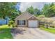 Charming single Gathering home featuring a single car garage, brick accent, and beautifully manicured lawn at 1321 Waterton Trl, Douglasville, GA 30134