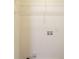 Utility room with wire rack shelving and washer and dryer hookups at 1321 Waterton Trl, Douglasville, GA 30134