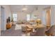 Bright living room with neutral decor, large windows, and vaulted ceilings for a spacious feel at 1321 Waterton Trl, Douglasville, GA 30134