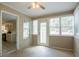 Bright sun room with multiple windows and easy access to the kitchen at 1321 Waterton Trl, Douglasville, GA 30134