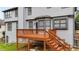 View of the backyard from the wood deck that has stairs to the ground at 4963 Kingsbridge Ct, Powder Springs, GA 30127