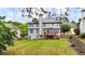 Spacious backyard with a lush green lawn and a wooden deck, perfect for outdoor entertaining at 4963 Kingsbridge Ct, Powder Springs, GA 30127
