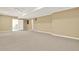 Large finished basement with neutral carpet, recessed lighting, and ample space at 4963 Kingsbridge Ct, Powder Springs, GA 30127