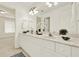 Bright bathroom featuring a double vanity with modern fixtures and ample counter space at 4963 Kingsbridge Ct, Powder Springs, GA 30127