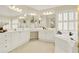 Bright bathroom featuring a vanity with dual sinks, a soaking tub, and plantation shutters at 4963 Kingsbridge Ct, Powder Springs, GA 30127