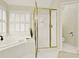 Bright bathroom featuring a glass shower and separate soaking tub at 4963 Kingsbridge Ct, Powder Springs, GA 30127