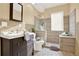 Modern bathroom featuring a glass enclosed shower, wood-look tile, and a stylish vanity at 4963 Kingsbridge Ct, Powder Springs, GA 30127