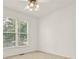 Well lit bedroom with large window provides ample natural light at 4963 Kingsbridge Ct, Powder Springs, GA 30127