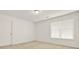 Simple bedroom with a window and neutral carpeting at 4963 Kingsbridge Ct, Powder Springs, GA 30127