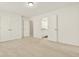 Spacious bedroom with neutral carpet, closet, and ensuite bathroom at 4963 Kingsbridge Ct, Powder Springs, GA 30127