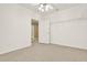 Bright bedroom with neutral carpet and overhead lighting, featuring shelving at 4963 Kingsbridge Ct, Powder Springs, GA 30127