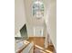 Bright foyer with high ceilings, a large window, and a chandelier creating a grand entrance at 4963 Kingsbridge Ct, Powder Springs, GA 30127