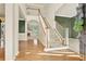 Inviting foyer with hardwood floors, a staircase, and views into adjacent rooms at 4963 Kingsbridge Ct, Powder Springs, GA 30127