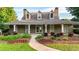 Welcoming front entrance with a covered porch, perfect for enjoying the outdoors with curb appeal at 4963 Kingsbridge Ct, Powder Springs, GA 30127