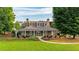 Charming single-story home featuring dormer windows and a sprawling, beautifully landscaped front yard at 4963 Kingsbridge Ct, Powder Springs, GA 30127