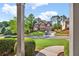 A charming two-story brick home with manicured landscaping, as seen from the front porch at 4963 Kingsbridge Ct, Powder Springs, GA 30127