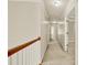 Hallway featuring neutral walls, carpet flooring and access to other rooms, highlighting the home's layout at 4963 Kingsbridge Ct, Powder Springs, GA 30127