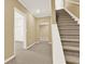 Hallway with carpeted stairs leading to rooms at 4963 Kingsbridge Ct, Powder Springs, GA 30127