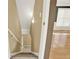 Hallway with carpeted stairs leading to rooms with wood floors and natural light at 4963 Kingsbridge Ct, Powder Springs, GA 30127