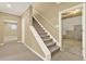 Hallway with carpeted stairs leading to a basement at 4963 Kingsbridge Ct, Powder Springs, GA 30127