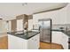 The expansive kitchen features plenty of cabinets and counter space at 4963 Kingsbridge Ct, Powder Springs, GA 30127